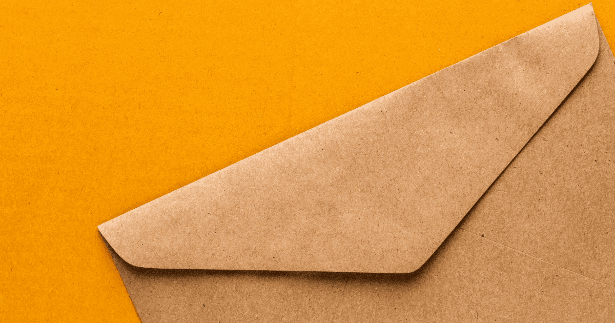 Brown kraft paper envelope on a yellow background